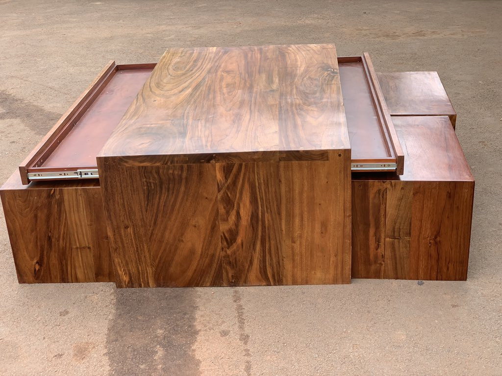 The flawless wooden center table with four side tables would totally transform your living area.